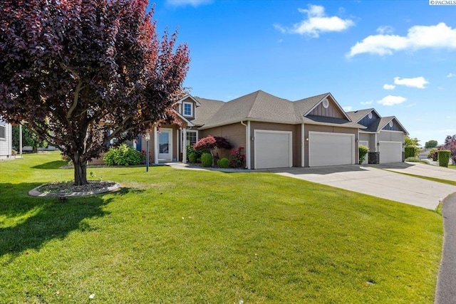 106 Muirfield Ln, Pasco, WA 99301 - view of front of house with an attached garage, concrete driveway, and a front lawn
