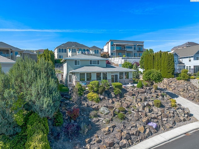 view of front of home with a residential view