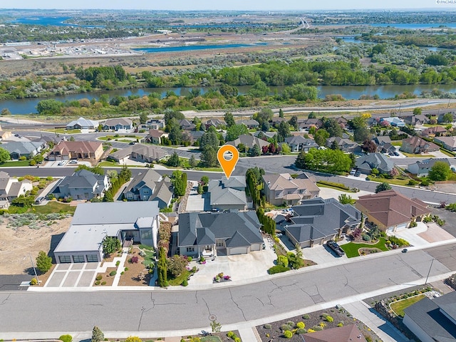 aerial view featuring a water view and a residential view