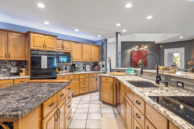 4107 Mojave Ct, Pasco, WA 99301 - kitchen with black appliances, a sink, decorative backsplash, recessed lighting, and light stone countertops