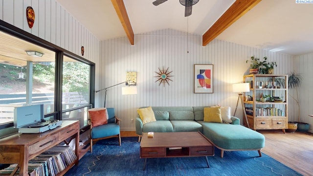 living area featuring vaulted ceiling with beams, dark wood-type flooring, and ceiling fan