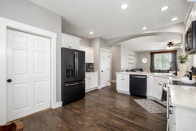 5 Hollyhock Ct, Pasco, WA 99301 - kitchen featuring black appliances, arched walkways, a peninsula, a ceiling fan, and white cabinets
