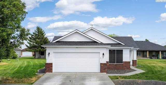 5 Hollyhock Ct, Pasco, WA 99301 - ranch-style home featuring brick siding, concrete driveway, an attached garage, and a front lawn