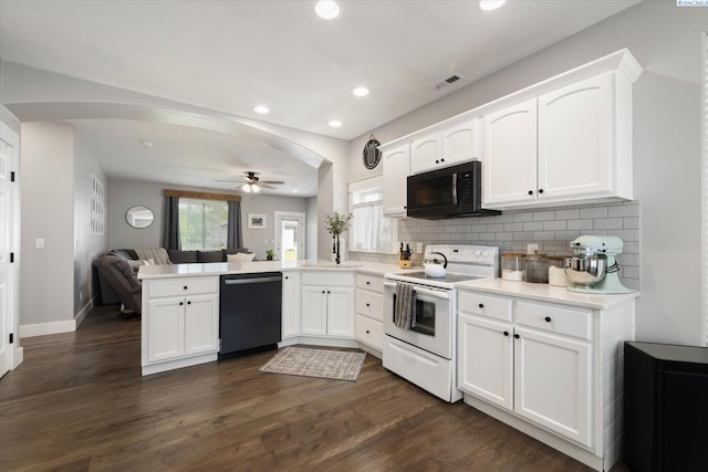 5 Hollyhock Ct, Pasco, WA 99301 - kitchen featuring dishwasher, white electric range, black microwave, arched walkways, and a peninsula
