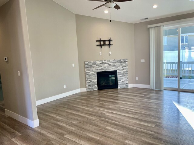 unfurnished living room with visible vents, baseboards, recessed lighting, wood finished floors, and a ceiling fan