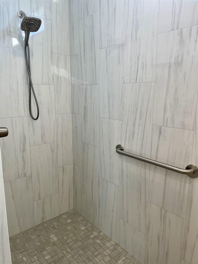 bathroom with tiled shower