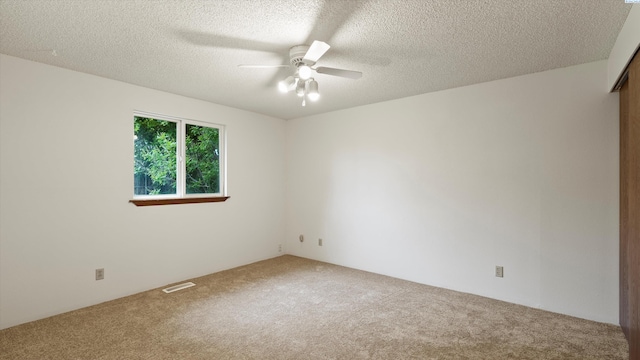 5456 Fern Loop, West Richland, WA 99352 - spare room featuring carpet flooring, ceiling fan, and a textured ceiling