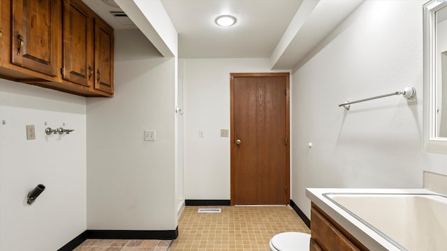 5456 Fern Loop, West Richland, WA 99352 - washroom featuring baseboards and light floors