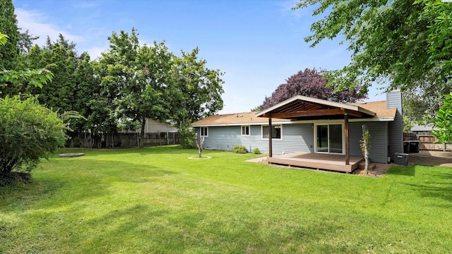 5456 Fern Loop, West Richland, WA 99352 - rear view of property with a wooden deck and a chimney