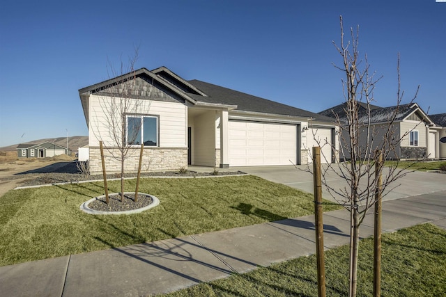 view of front of house featuring a garage and a front lawn