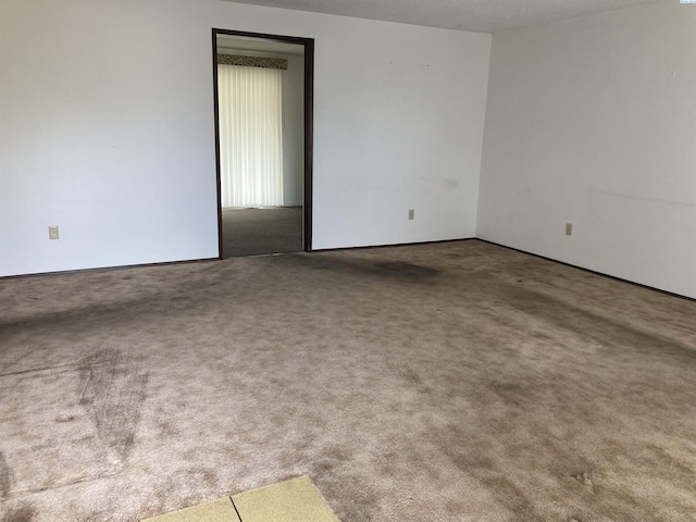 empty room featuring carpet floors