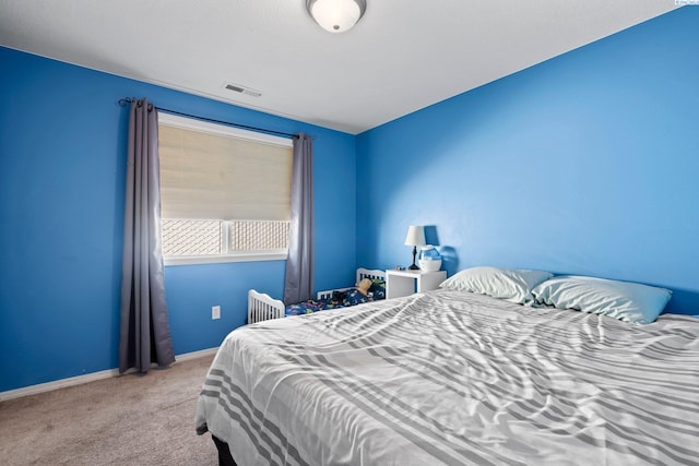 bedroom with light colored carpet