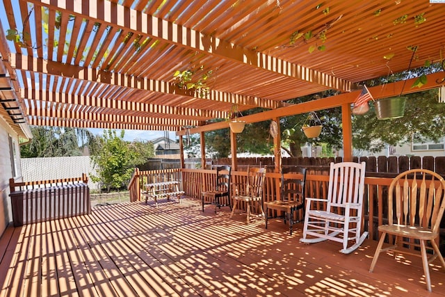 wooden terrace with a fenced backyard and a pergola