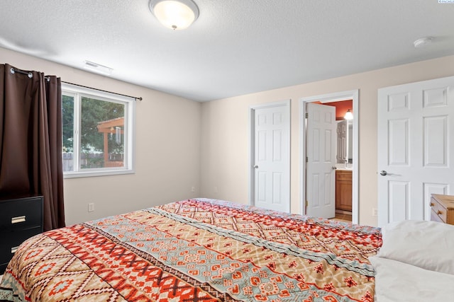 bedroom featuring a textured ceiling