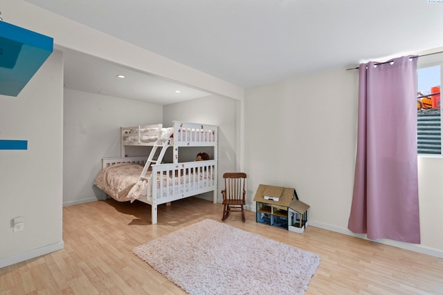 bedroom with hardwood / wood-style floors