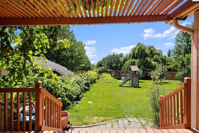 view of yard featuring a playground and a fenced backyard