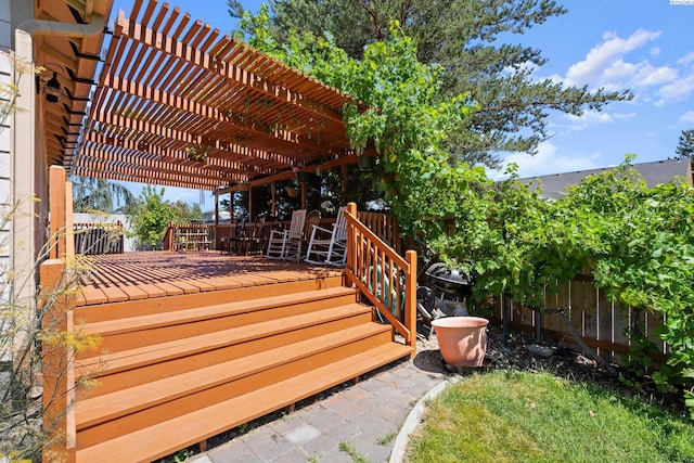 wooden deck featuring a pergola