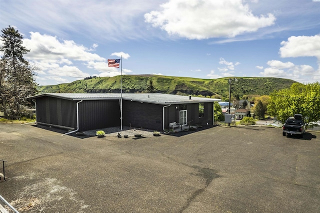 view of car parking with a mountain view