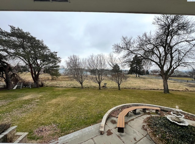 view of yard with a rural view