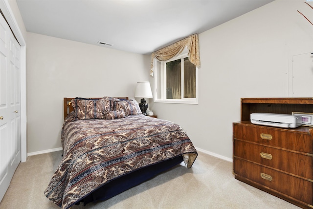 carpeted bedroom with a closet