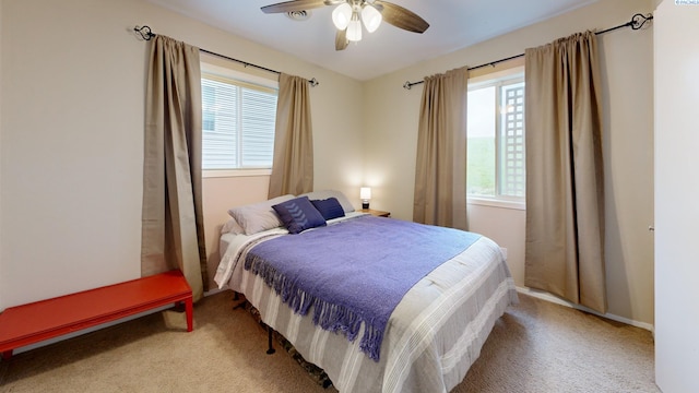 bedroom featuring carpet flooring, baseboards, and ceiling fan