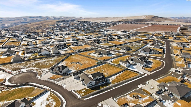 birds eye view of property with a mountain view