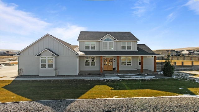 view of front facade featuring a front lawn and a porch