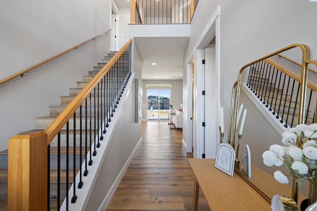 entryway with hardwood / wood-style flooring