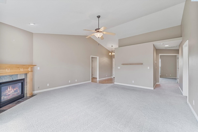 unfurnished living room featuring carpet, a fireplace, a ceiling fan, lofted ceiling, and baseboards