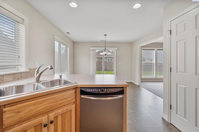 kitchen featuring dishwasher, a sink, plenty of natural light, a peninsula, and recessed lighting
