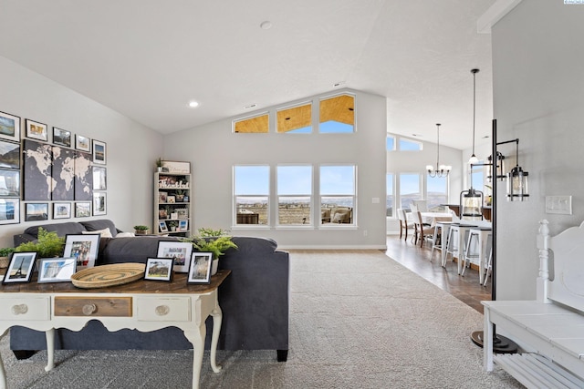 office area featuring a chandelier, high vaulted ceiling, and carpet