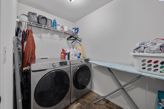 6115 Wildcat Ln, Pasco, WA 99301 - laundry area with baseboards, stone finish flooring, separate washer and dryer, and laundry area