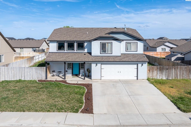 6115 Wildcat Ln, Pasco, WA 99301 - traditional-style house featuring a porch, a shingled roof, driveway, and a front lawn