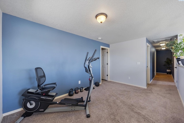 6115 Wildcat Ln, Pasco, WA 99301 - workout area with a textured ceiling, visible vents, and carpet