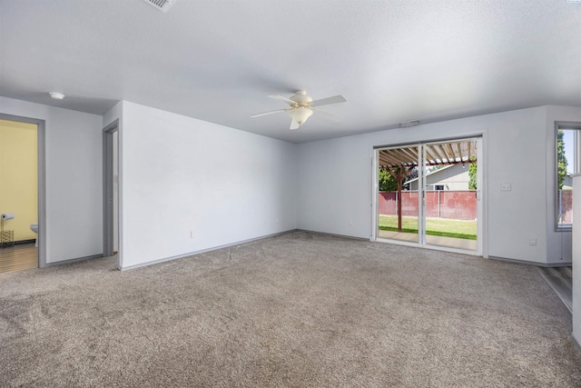 8307 Camano Dr, Pasco, WA 99301 - empty room with ceiling fan, carpet flooring, and a smoke detector