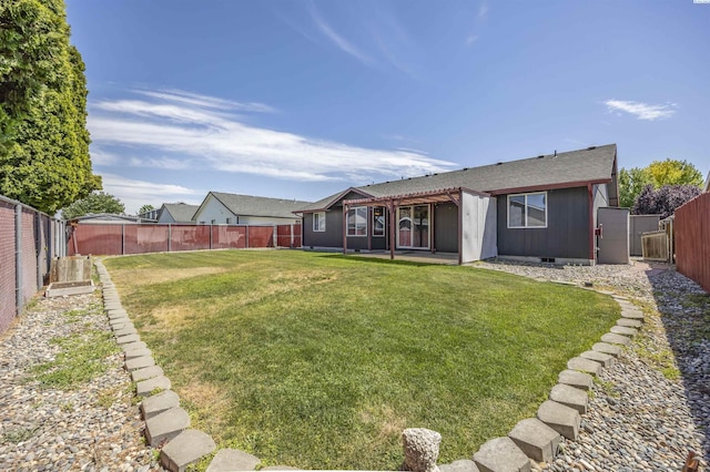 8307 Camano Dr, Pasco, WA 99301 - back of house featuring a fenced backyard and roof with shingles