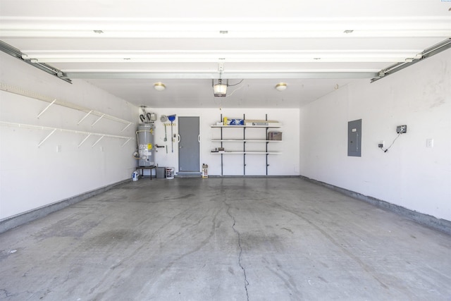8307 Camano Dr, Pasco, WA 99301 - garage with electric panel, secured water heater, and a garage door opener