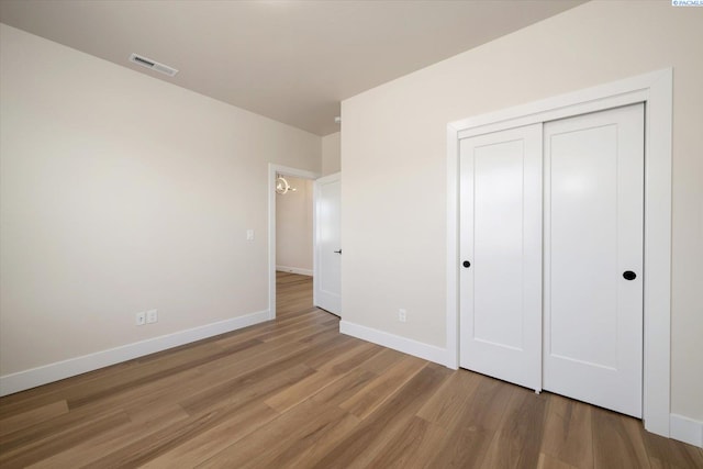561 Lazio Way, Richland, WA 99352 - unfurnished bedroom with light wood-style flooring, baseboards, and a closet