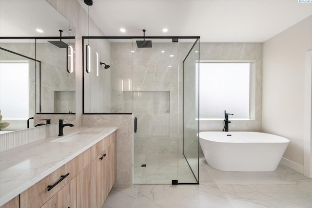 561 Lazio Way, Richland, WA 99352 - full bathroom featuring marble tiled floors, a shower stall, vanity, a freestanding bath, and recessed lighting