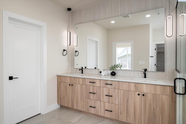 561 Lazio Way, Richland, WA 99352 - full bath with double vanity, baseboards, and recessed lighting