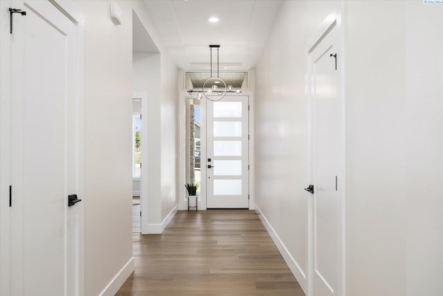 561 Lazio Way, Richland, WA 99352 - hallway with a chandelier, wood finished floors, baseboards, and recessed lighting