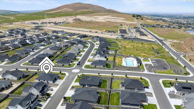 561 Lazio Way, Richland, WA 99352 - aerial view of property's location with nearby suburban area and a mountainous background