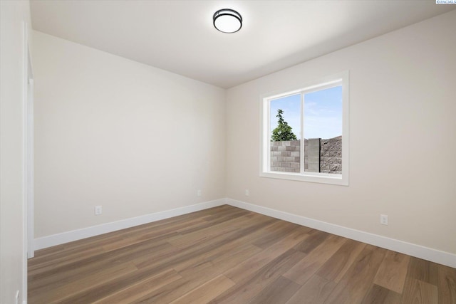 561 Lazio Way, Richland, WA 99352 - unfurnished room featuring baseboards and wood finished floors