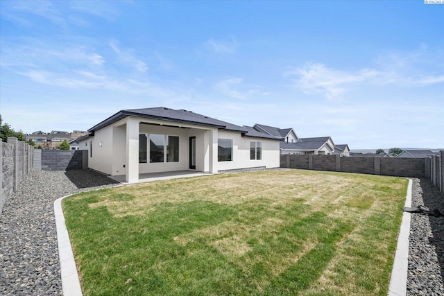 561 Lazio Way, Richland, WA 99352 - back of house with stucco siding and a patio