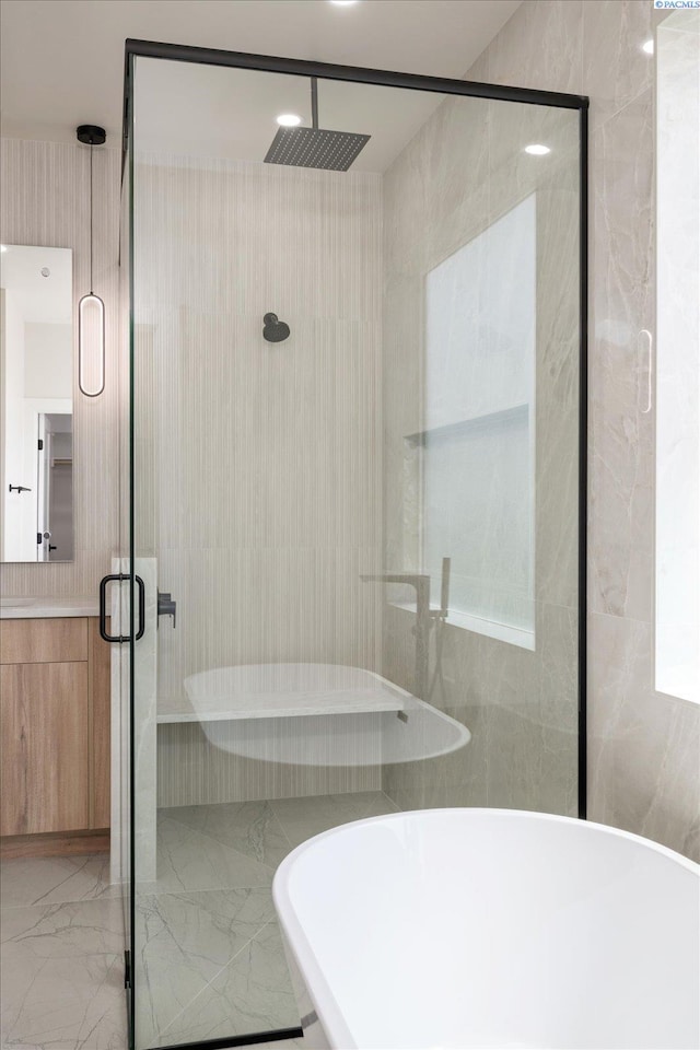 561 Lazio Way, Richland, WA 99352 - bathroom featuring marble tiled floors, a shower stall, a soaking tub, and vanity