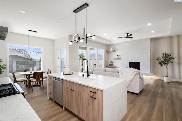 561 Lazio Way, Richland, WA 99352 - kitchen with a sink, light brown cabinetry, dishwasher, a chandelier, and recessed lighting