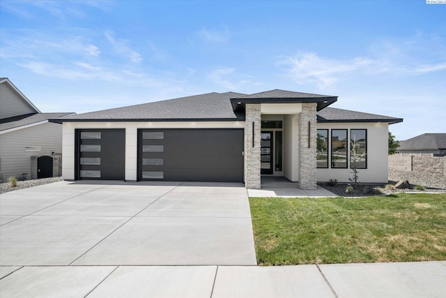561 Lazio Way, Richland, WA 99352 - view of front of home featuring an attached garage, concrete driveway, a front lawn, and a shingled roof