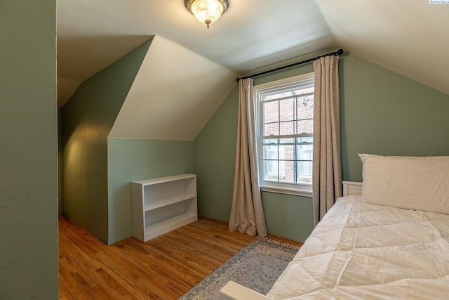 525 SE Water St, Pullman, WA 99163 - bedroom with wood finished floors and lofted ceiling