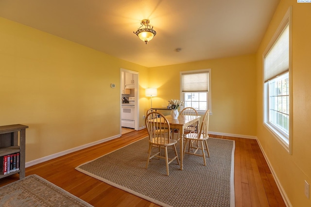 525 SE Water St, Pullman, WA 99163 - dining room featuring wood-type flooring and baseboards
