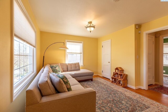 525 SE Water St, Pullman, WA 99163 - living room featuring baseboards and wood finished floors